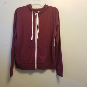 Ruby red hooded zip up sweatshirt.